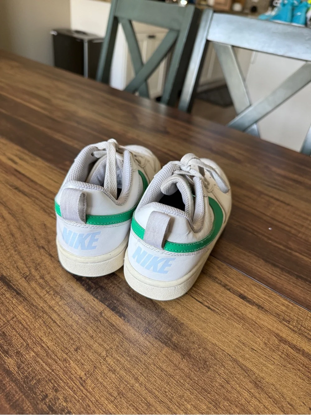 Nike White Low-Top Sneakers with Green Swoosh
